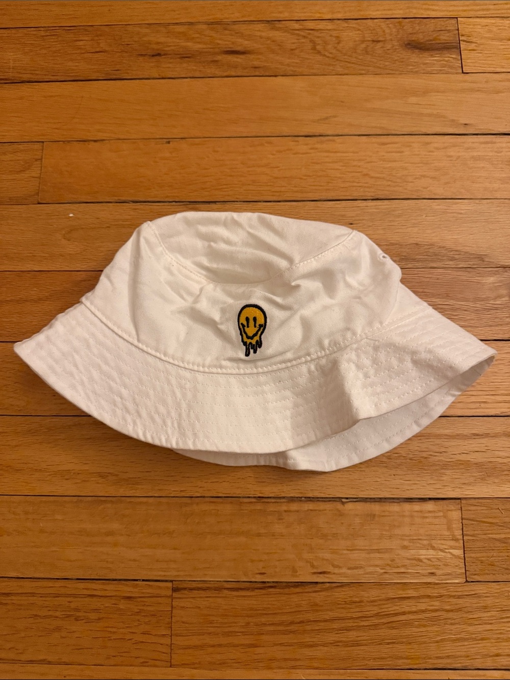PacSun White Bucket Hat with Yellow Smiley Drip Patch
